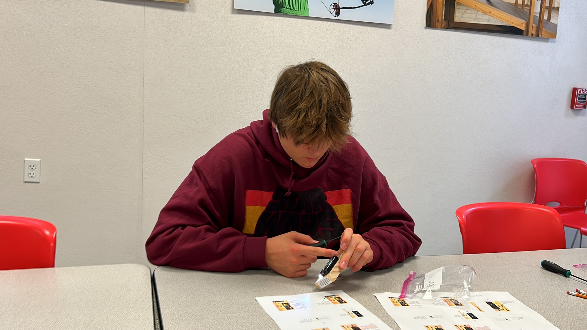 A person sitting at a tableDescription automatically generated
